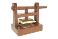 Model printing press made by Richard Cuming.
