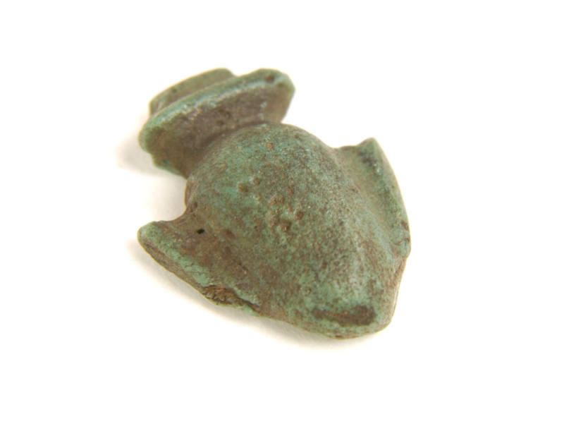 One of 7 small vase amulets; heart-shaped emblems with 2 handles and flat backs.