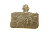 Pendant of bronze, depicting two horses with a man standing between them. 