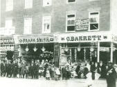 Black and white photograph of G. Barrett fishmonger and Frank Smith, greengrocer. 24 and 24a Pe…