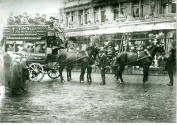 Black and white photograph depicting a four team horse bus, owned by the Thomas Tilling Bus Com…