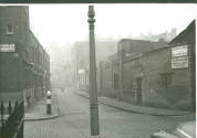 Black and white photograph depicting the remains of  the former Mint Street Workhouse, on the c…