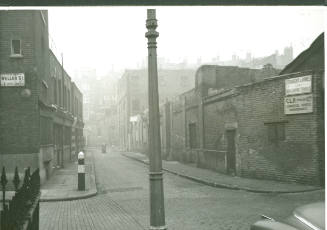 Black and white photograph depicting the remains of  the former Mint Street Workhouse, on the c…